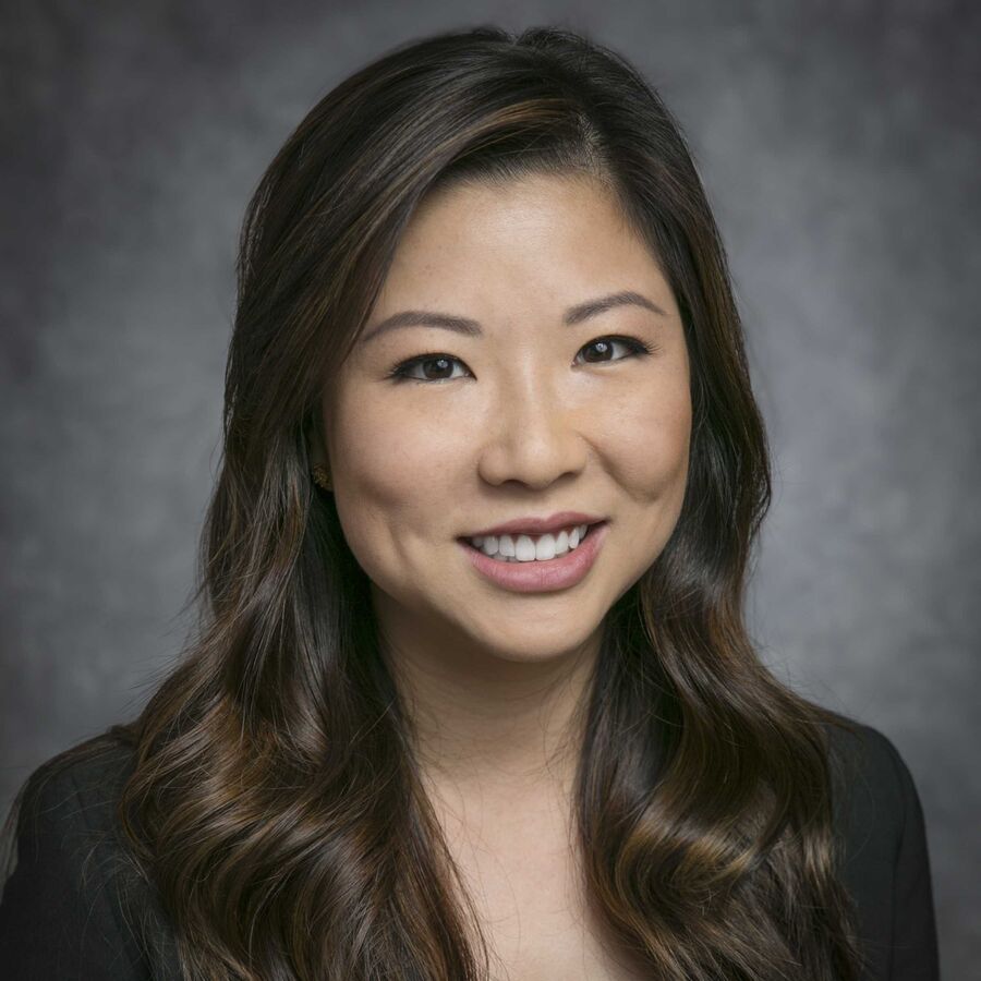 Professional headshot of a smiling woman