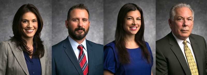 Team headshots on a mottled grey backdrop